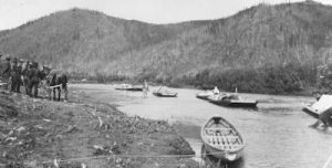 Horse-towed freight scows arrive at Ophir, on the upper Innoko River, from Dishkaket on July 24, 1910. Photo by A.G. Maddren, USGS public domain image.