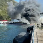 Local and state authorities work to extinguish a fire at the cruise ship pier in Whittier, Alaska Sept. 14, 2026. Multiple vessels were moored at the pier during the time of the initial report and were moved to prevent further spread of the fire. (U.S. Coast Guard courtesy photo)
