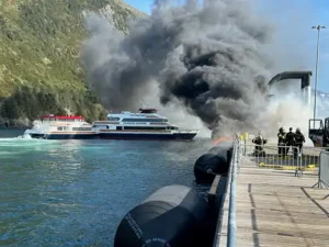 Local and state authorities work to extinguish a fire at the cruise ship pier in Whittier, Alaska Sept. 14, 2026. Multiple vessels were moored at the pier during the time of the initial report and were moved to prevent further spread of the fire. (U.S. Coast Guard courtesy photo)