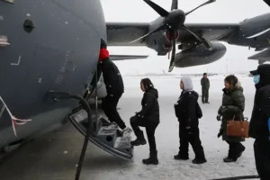 Photo By Staff Sgt. Seth LaCount | Students and staff from the Kusilvak Career Academy walk onto a HC-130J Combat King II during a tour given by the Alaska Air National Guard on Joint Base Elmendorf-Richardson, April 5, 2024. Aviation, maintenance and search and rescue personnel from the 176th Wing guided the students through each aircraft and answered questions ranging from deployment experience to the price of each aircraft. (Alaska National Guard photo by Seth LaCount) 