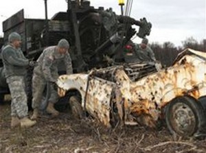 Soldiers of the 207th Combat Support Company, Alaska Army National Guard assisting with clean-up at the Goose Bay State Game Refuge. (U.S. ANG photo/Spc. Michelle Nash)