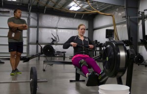 Sgt. Chantal LeDue, office of the deputy state surgeon, Alaska Army National Guard, completes one of the five weekly workouts during the 2015 CrossFit Open Games at the 907 CrossFit facility on Camp Carroll, March 27. LeDue is being scored by a CrossFit Level 1 instructor, 1st Lt. Danny Canlas, Jr.(Photo by Kalei Rupp, Alaska National Guard Public Affairs)