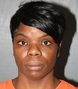 33-year-old East Point woman, Ebony Dickens was arrested after posting online threats on Facebook police allege. Image-East Point Police booking photo