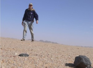 Peter Jenniskens, a meteor astronomer with the SETI (Search for Extraterrestrial Intelligence) institute, is here pictured with meteorite pieces he found in Sudan in 2008. He is now on a similar search in the Alaska wilderness. Photo courtesy Peter Jenniskens.