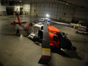 A Coast Guard MH-60 Jayhawk helicopter from Air Station Kodiak, Alaska, rests in the Deadhorse Aviation Center hangar in Prudhoe Bay.(U.S. Coast Guard photo by Petty Officer 1st Class Shawn Eggert)