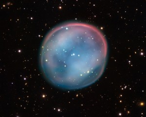 This extraordinary bubble, glowing like the ghost of a star in the haunting darkness of space, may appear supernatural and mysterious, but it is a familiar astronomical object: a planetary nebula, the remnants of a dying star. Image-ESO