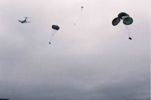 An Alaska Air National Guard C-17 Globemaster III with the 249th Airlift Squadron drops two small unit support vehicles and supporting equipment during a joint airdrop operation performed at Malamute Drop Zone, Joint Base-Elmendorf-Richardson, Sept. 15.(U.S. Army National Guard photo by Sgt. Marisa Lindsay)