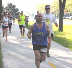 Command Sgt. Maj. Marc Petersen represents the Alaska Army National Guard in the 2015 Lincoln marathon held in Lincoln, Neb., in May. Petersen has completed more than 10 half-marathons, 17 marathons, and two Ultra marathons; he hopes to run as long as he can. (Courtesy photo by the Nebraska National Guard)