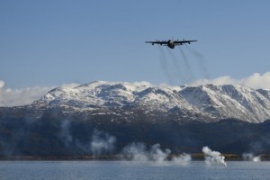 An HC-130 from the 211th Rescue Squadron drops signal flares in Homer’s inner bay as part of rescue water training Sept. 30. (U.S. Air National Guard photo by Tech. Sgt. N. Alicia Halla)