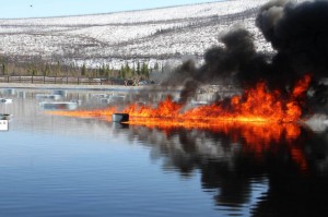 Oil burns on a manmade water basin at Poker Flat Research Range in April 2015. Photo by Len Zabilansky.