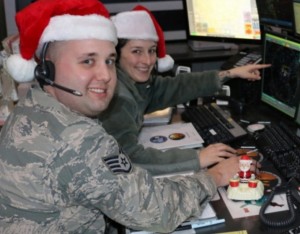 Staff Sgt. Tom Silva and Staff Sgt. Rachael Alcorta practice Santa tracking at the Eastern Air Defense Sector in Rome. EADS plays a supporting role in NORAD's annual Santa tracking.