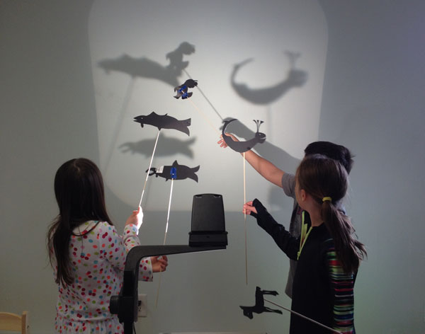 Sitka elementary students demonstrating shadow puppets made in an afternoon session with artist -in-residence Kimi Eisele. Image-The Island Institute 