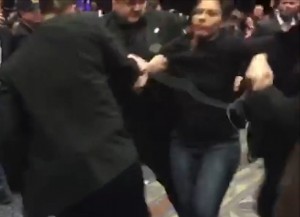 Protester being removed from Las Vegas rally amid shouts of "get out of here, Scumbag!" Image-Screengrab of Telegraph Internet video