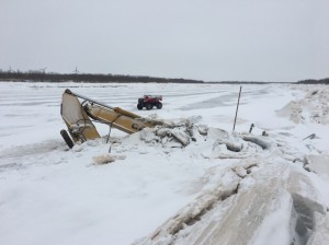 Excavator submerged in Qinaq River.(Photo/Carl McIntyre )