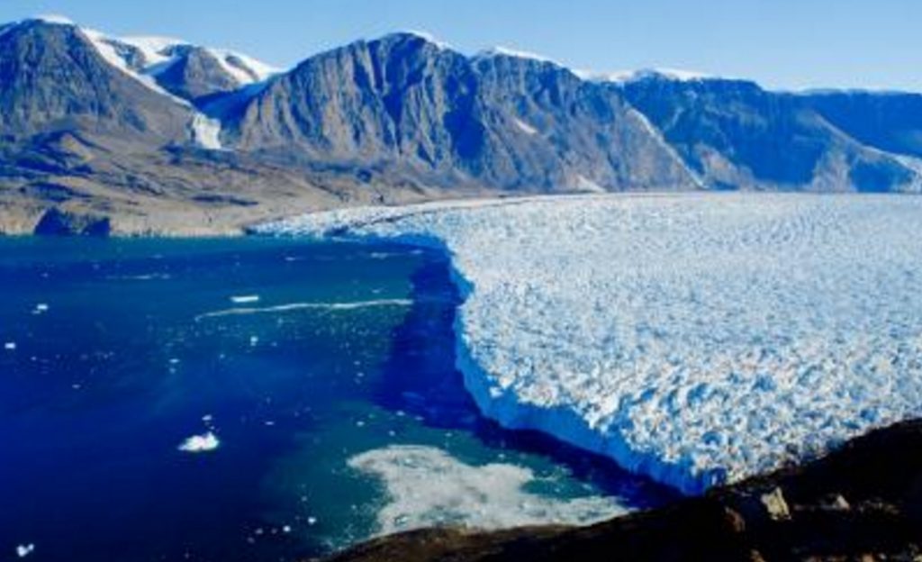 Dartmouth College scientists have found that surface meltwater draining through and underneath Greenland tidewater glaciers is accelerating their loss of ice mass. Image-Dartmouth College