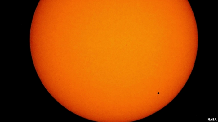 Mercury will transit the Sun today and will appear as a small black dot.