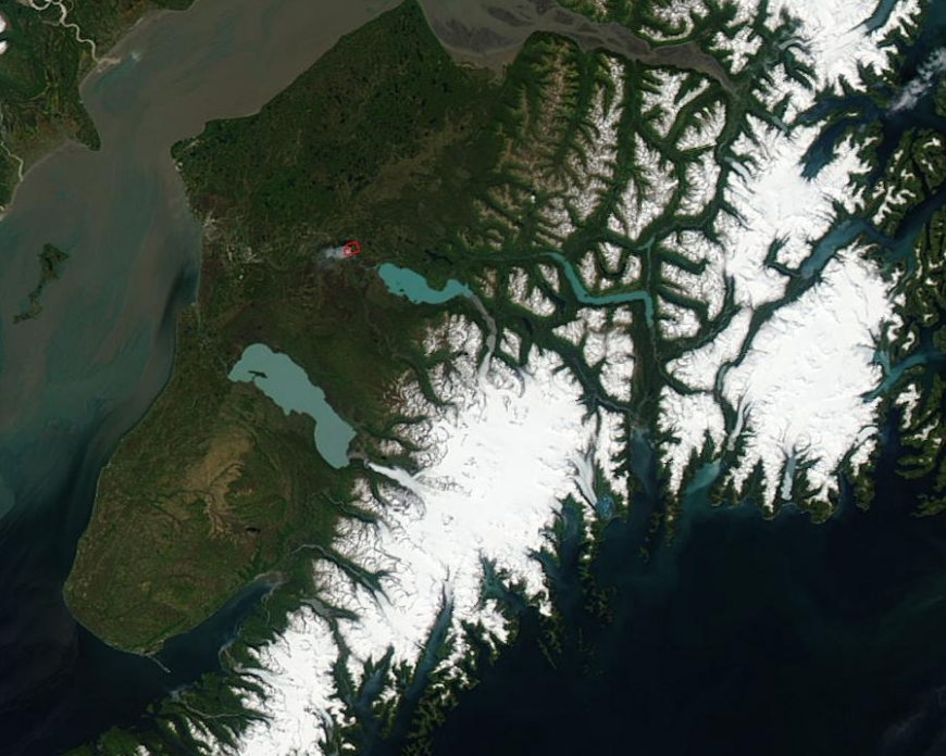 An image of the Kenai Peninsula on June 15, 2015, acquired from the Moderate Resolution Imaging Spectroradiometer aboard the Aqua satellite. The red box in this cropped image is a wildfire. Image credit: Jeff Schmaltz, NASA.