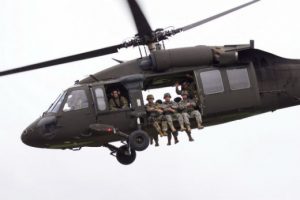 Alaska Army National Guard Soldiers preparing to jump out of a UH-60 Black Hawk for the unit's final jump. (U.S. Air Force photo by Senior Airman James Richardson)