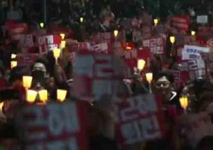 THrongs of protesters fill the streets calling for South Korea's president step down from office. Image-screengrab