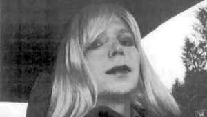 Pfc. Chelsea Manning poses for a photo wearing a wig and lipstick. Image-US Army