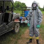 Investigating cases that involve the unlawful use of poisons is hazardous. The photo shows the special agent wearing a protective suit while investigating this case. Credit: USFWS