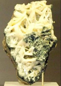 Naturally formed crystals of the mineral whitlockite, which is rare on Earth, are visible in this sample on display at Canada’s Royal Ontario Museum. (Credit: Wikimedia Commons)