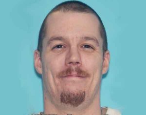38-year-old Jason Starkey, one of 12 of published warrant wants, was taken into custody at a South Cushman gas station on Tuesday. Image-AST