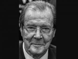 Sir Roger Moore at a 2014 book signing. Image- Wikipedia