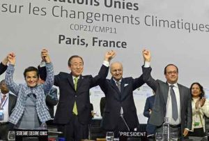 Secretary-General Ban Ki-moon (second left), UNFCCC's Christiana Figueres (left), French Foreign Minister Laurent Fabius and President of the UN Climate Change Conference in Paris (COP21), and President François Hollande of France (right), celebrate historic adoption of Paris Agreement. Photo: UNFCCC