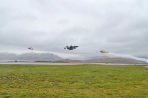 Coast Guard Cutter Midgett’s aviation detachment conducts flyovers alongside historic WWII airplanes, a Grumman JRF-5 Goose and a Canadian Harvard MK IV training plane, in Dutch Harbor. U.S. Coast Guard photo