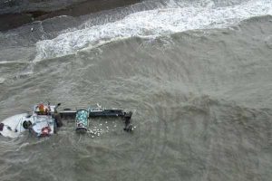 The driftnetter, F/V Ketok awash and aground on Ekuk Beach in Nushagak Bay. Image- Tim Sands | ADF&G