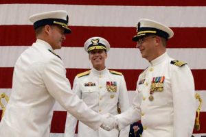 Capt. Jeffrey Good shakes hands with Capt. Jeffrey Westling after assuming command of Coast Guard Base Kodiak.  U.S. Coast Guard photo by Petty Officer 2nd Class Meredith Manning