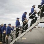 Members of the Type 2 University of Alaska-Fairbanks Nanook Fire Crew board a jet bound for Missoula, Montana on Aug. 11, 2017. Image-BLM