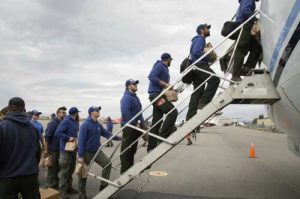 Members of the Type 2 University of Alaska-Fairbanks Nanook Fire Crew board a jet bound for Missoula, Montana on Aug. 11, 2017. Image-BLM