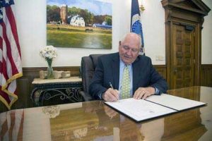 Agriculture Secretary Sonny Perdue signing a proclamation. Image-USDA