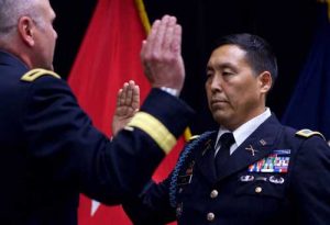 Alaska Army National Guard Col. Wayne Don, 38th Troop Command commander, pledges the Oath of Office, administered by Alaska Army National Guard Brig. Gen. Joseph Streff, Alaska Army National Guard commander, after Don promoted to full colonel.(U.S. Army photo by Sgt. David Bedard)