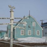 A signpost indicates geographic distances from Utqiagvik, formerly Barrow, where evidence of a warming climate has been dramatic this winter. Photo by Ned Rozell