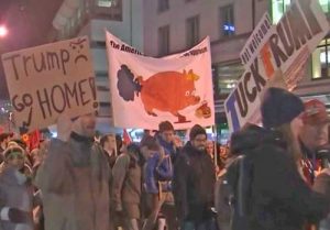 Marchers in Davos protesting the arrival of Trump. Image-Screenshot Reuters video