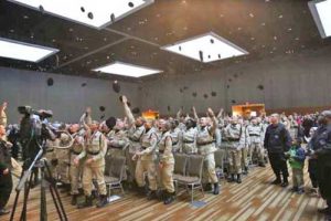 Cadets from the Alaska Military Youth Academy celebrate their graduation with a traditional hat toss.