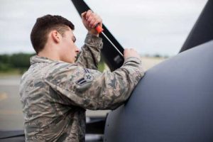 Airman 1st Class Trevor Galindo, crew chief for the 176th Maintenance Squadron, Alaska Air National Guard, removes a maintenance panel on an HC-130J at Joint Base Elmendorf-Richardson. (U.S. Air National Guard photo by Staff Sgt. Daniel Bellerive)