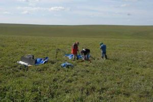 NSIDC scientist Kevin Schaefer (left), and researchers Alessio Gusmeroli and Lin Liu prepare to drill a permafrost core on the North Slope of Alaska near Happy Valley airport. Credit: Tingjun Zhang. High-resolution image 