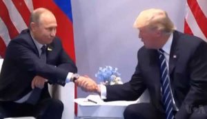 Trump and Putin shaking hands in July 2017 Hamburg press conference. VOA