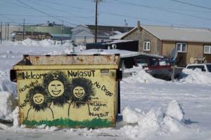 A welcoming dumpster greets visitors to Nuiqsut, a village of 411 people in an oil-rich region of Alaska’s North Slope. Image-Ned Rozell