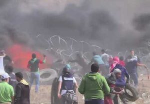 Palestinians on the Gaza strip as fatal violence increases death toll on Monday. Image-Youtube screengrab