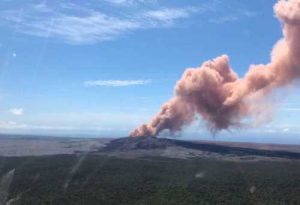 In this photo provided by the U.S. Geological Survey, red ash rises from the Puu Oo vent on Hawaii's Kilauea Volcano after a magnitude-5.0 earthquake struck the Big Island, Thursday