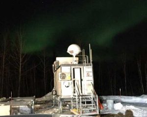 Fairbanks, Alaska, upper air building prepped and waiting for its first mission on April 19 to launch weather balloons, with Northern Lights dancing in the backdrop. (Credit: NOAA)