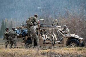 Alaska Air National Guardsmen assigned to the 212th Rescue Squadron, 176th Wing, unload equipment while responding to a simulated mass-casualty incident during a full mission profile exercise at Joint Base Elmendorf-Richardson. (U.S. Air Force photo by Alejandro Peña)