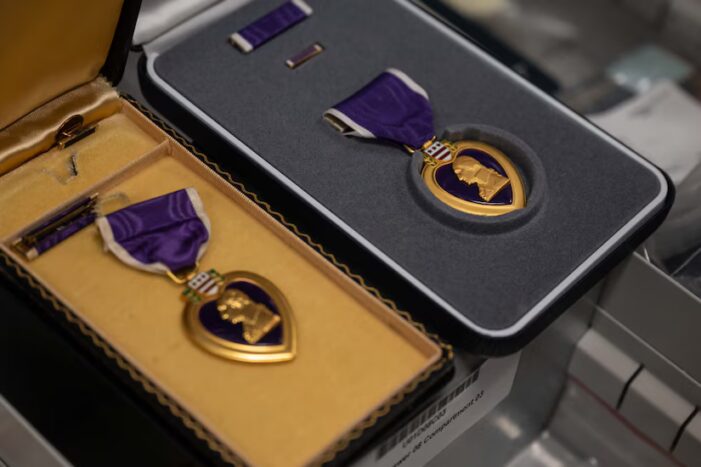 Two Purple Heart medals with ribbons sit inside cushioned boxes at The Institute of Heraldry at Fort Belvoir, Va. The Purple Heart: America’s Oldest Medal