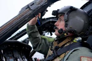 Alaska Air National Guard Maj. Tyler Seibold, 210th Rescue Squadron HH-60G Pave Hawk pilot, carries out preflight checks. (Alaska Air National Guard photo by David Bedard)