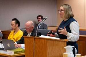 Prosecutor Rebecca Weiant addresses the court during the sentencing of Chue Yang, who is pictured far left. Photo by Patty Sullivan/LAW.